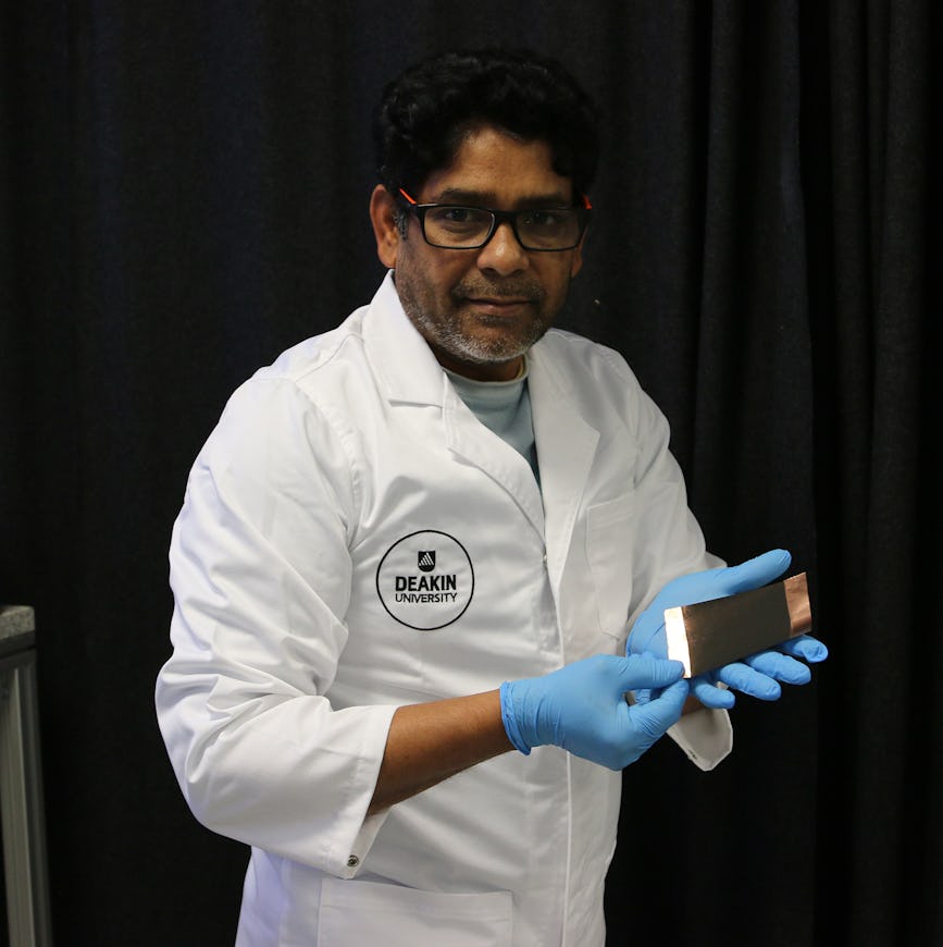 Lead researcher Dr Md Mokhlesur Rahman holding an anode made of nano silicon extracted from used solar panels (Image source Deakin University).
