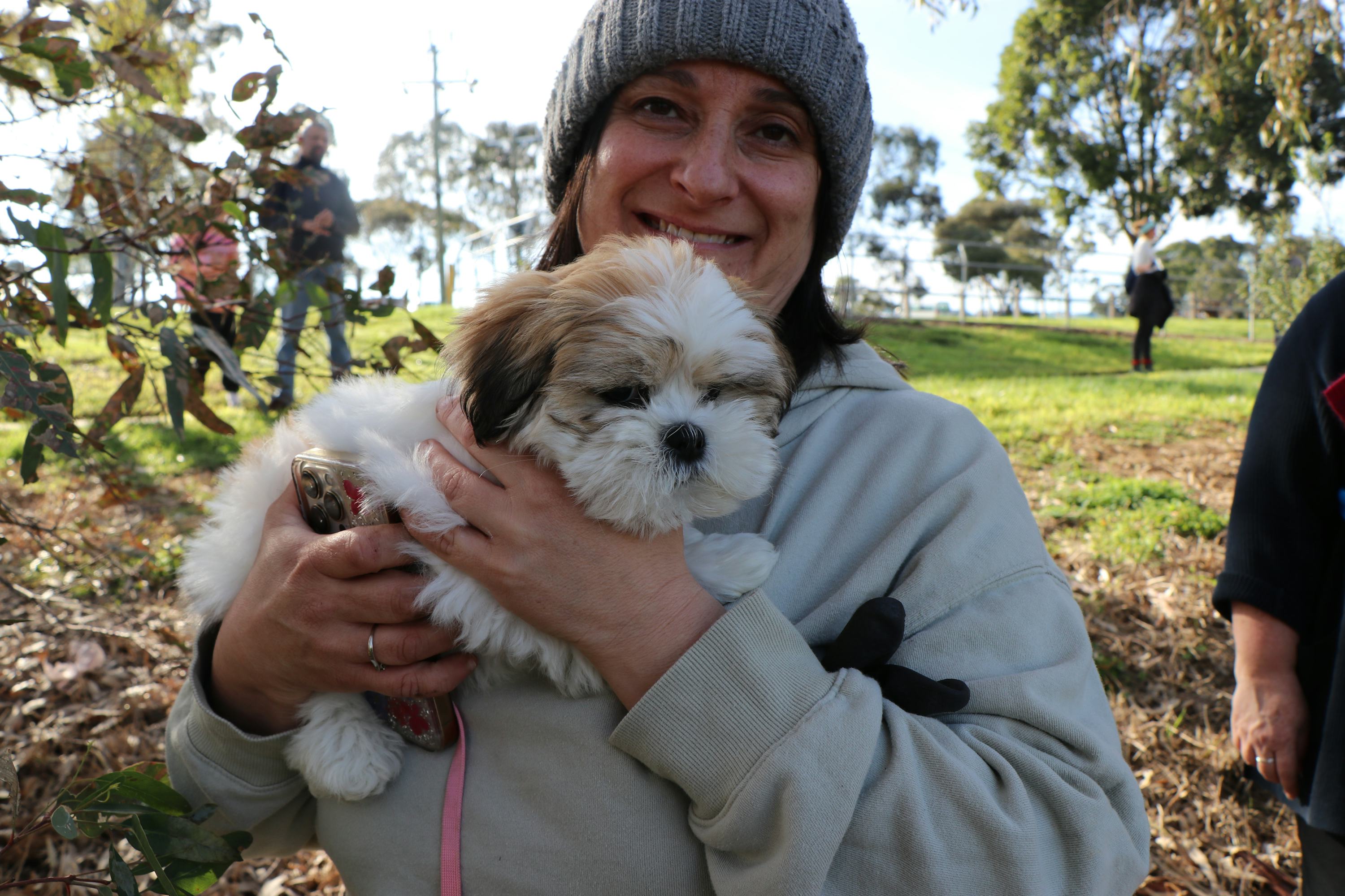 Lucy the puppy and friend at the planting site. Image credit: Jen McMillan