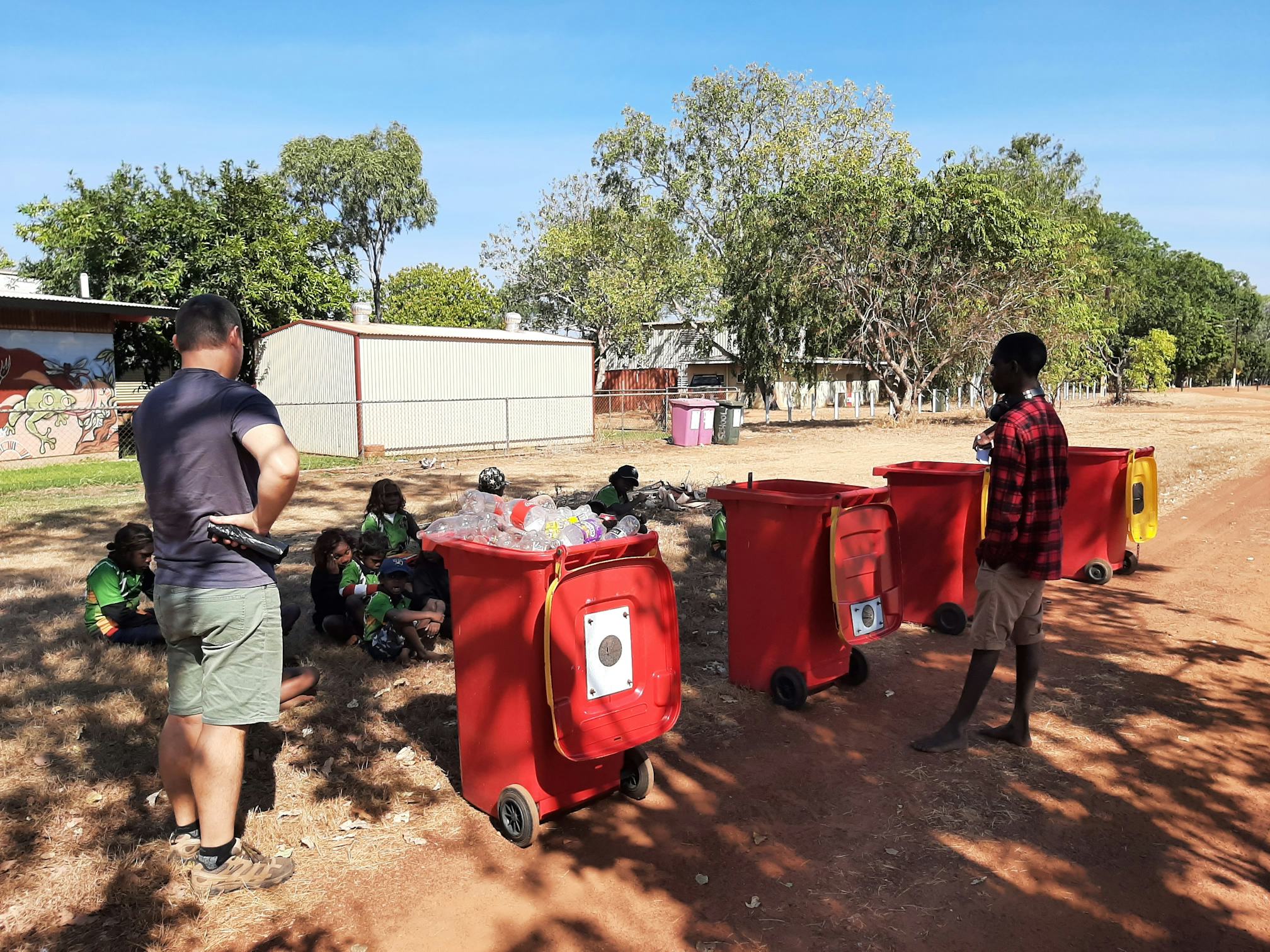 Principle Ben Kleinig and students counting materials in preparation for the Container Deposit Scheme in Katherine.  