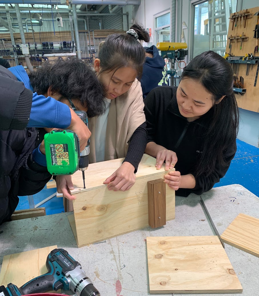 Students in the workshop constructing wooden nest boxes. (Image source: Ken Beasley)