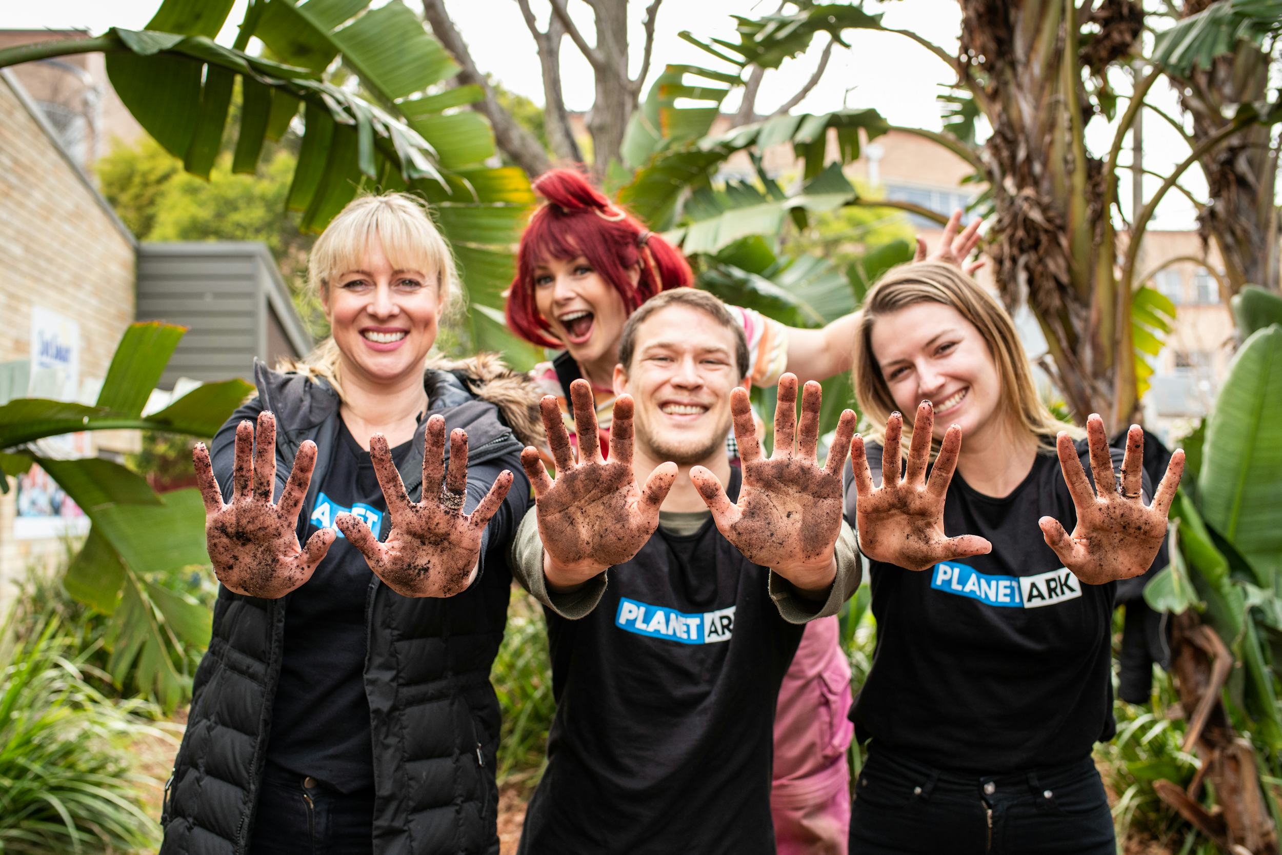 dirtgirl getting grubby with Planet Ark staff at a National Tree Day event in 2019.